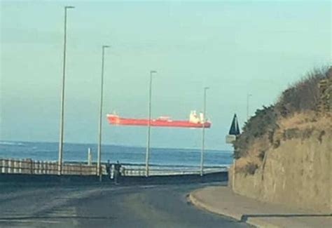 Ship appears to hover in the air due to optical illusion in Scotland ...