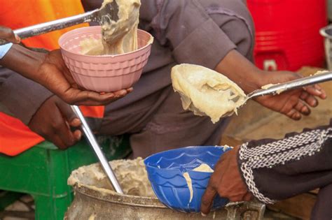 Under siege, Sudanese risk their lives to feed each other