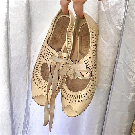 Tan ballet flats with cute ribbon tie. A little worn... - Depop