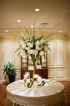 Flower Arrangements Wedding Reception by Flower Arrangement With Ivory Roses And Delphiniums Flower Arrangements Wedding Reception