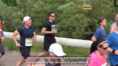 Some 40,000 runners cross Europe’s longest bridge and tunnel link on ...