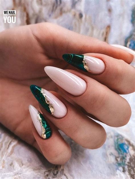 white nails with emerald green