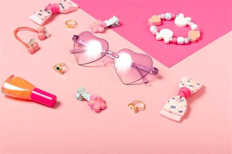 Baby accessories sunglasses and a hat on a pink background little girls ...