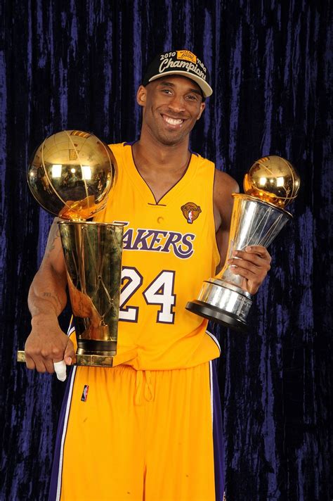 Kobe Bryant Holding Trophies