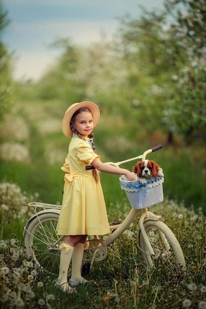 Friendship of children and pets a cute girl and a little puppy cavalier ...