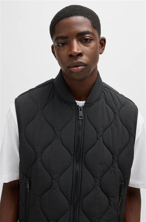 HUGO - Water-repellent quilted gilet with logo patch - Black