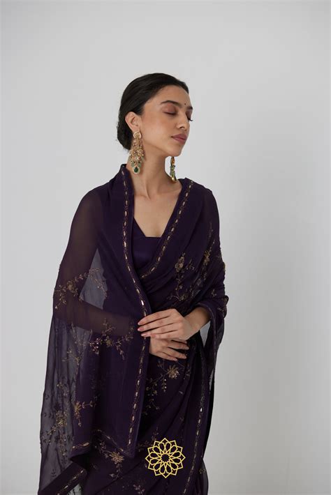 Yutika - An aubergine chiffon hand embroidered chiffon saree with tona