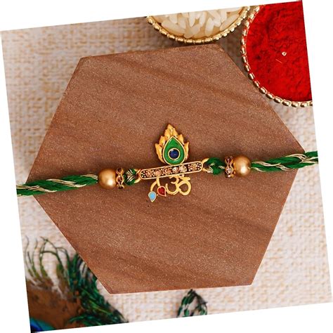 eCraftIndia Purple Set of 2 Floral & Pearl Designer Rakhis with Roli ...