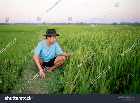 Attractive Young Asian Farmer Kneeling Down Stock Photo 2197831689 ...