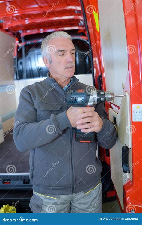 Senior Man Screwing Panel on To Van Rear Door Stock Image - Image of ...