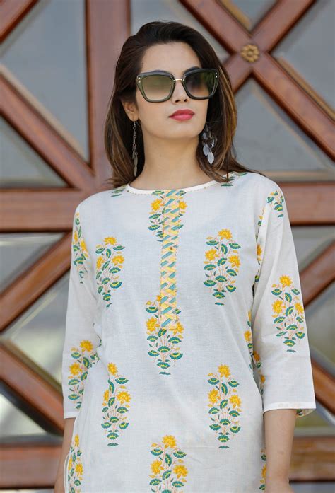 White Kurti Palazzo with yellow flowers. – www.soosi.co.in