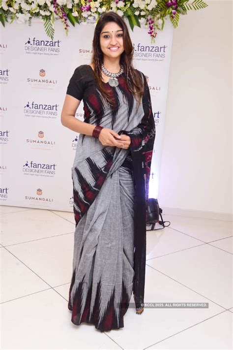 Chetan poses with Bharat during the launch of fans store 'Fanzart' at ...