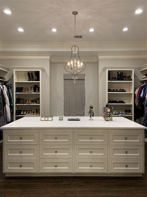 Tuscan Inspired Walk-In Closet with Island and Chandelier