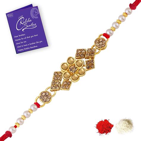 Buy Sukkhi Blossomy Gold Plated Floral Rakhi with Roli Chawal and ...