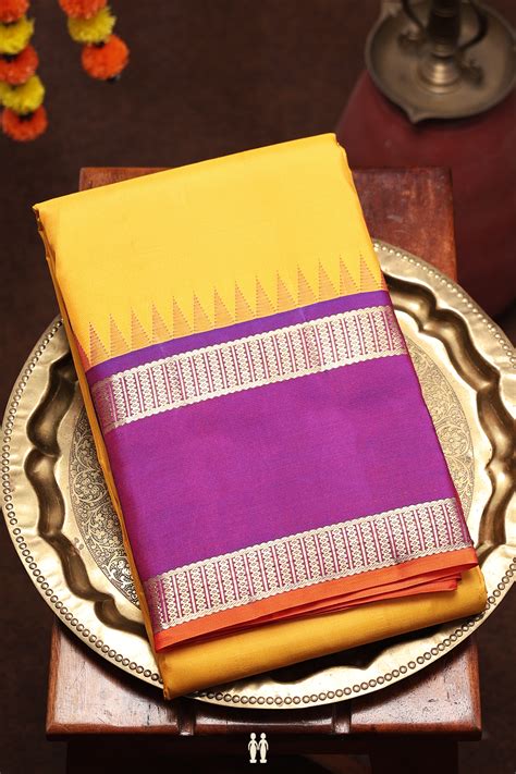 Kanchipuram Silk Saree In Plain Yellow With Contrast Border