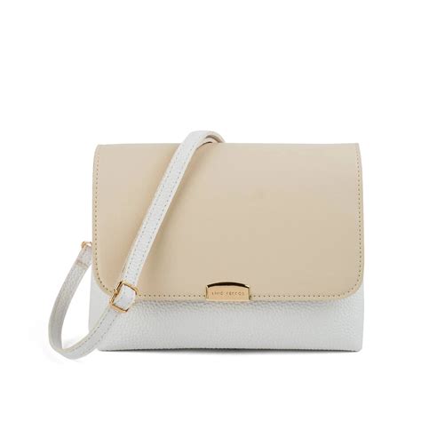 Buy Avril Daily Off White Sling Bag | Lino Perros