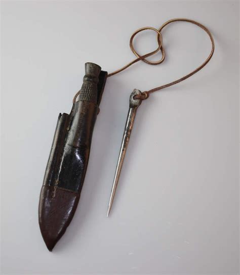 Lot - A sailors sheath knife and marlin spike,