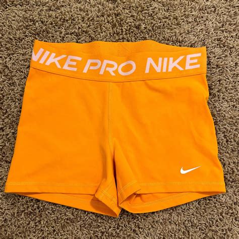 orange nike pro shorts. ive worn them once or twice,... - Depop