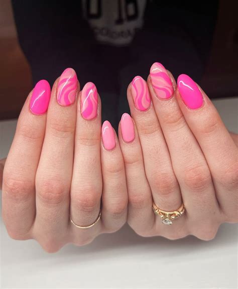 https://www.naildesignsdaily.com/wp-content/uploads/2023/02/pink-swirl-nails-22-1266x1536.jpeg