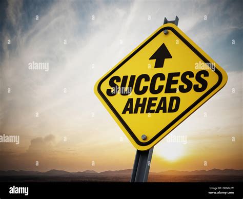 Success ahead road sign on setting sun background Stock Photo - Alamy