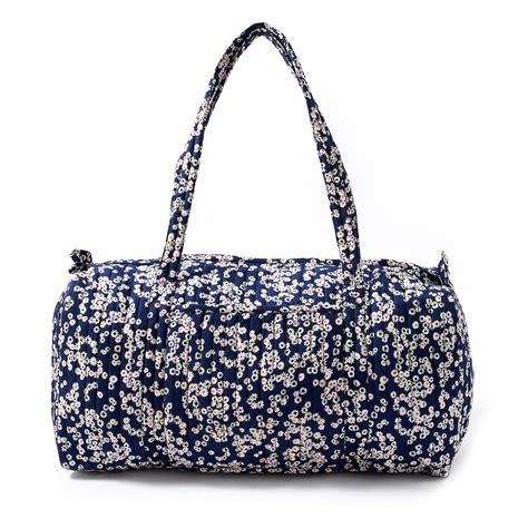 Accessorize London women's Blue Fabric Ditsy Daisy Weekender Travel ba ...
