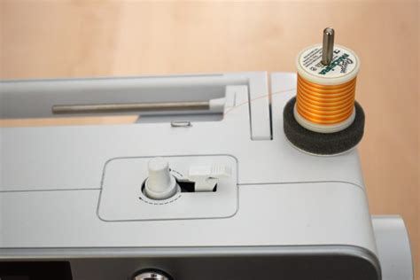 Image result for How to Use Large Thread Spool On Machine