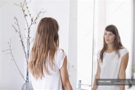Girl Looking At Mirror – Telegraph