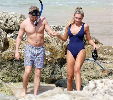 Zara McDermott in a Navy Blue Swimsuit in Barbados 12/18/2022 • CelebMafia