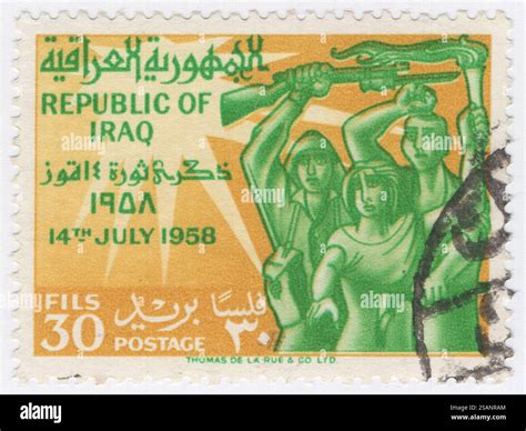 IRAQ - 1959 July 14: 30 fils ocher and emerald postage stamp depicting Victorious Revolution ...