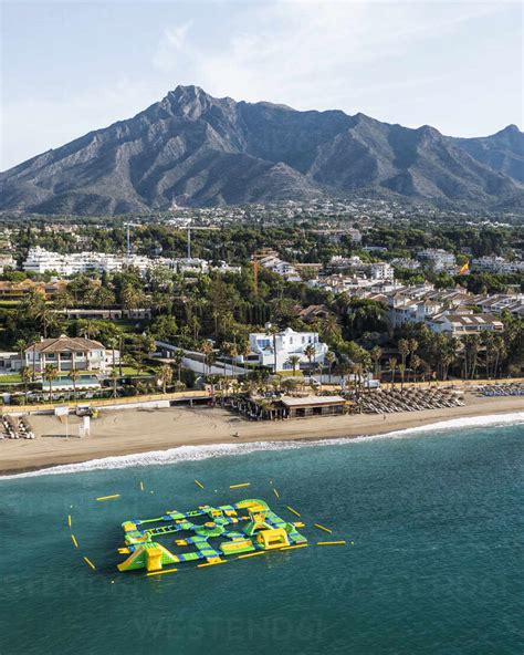 https://us.images.westend61.de/0001853739pw/aerial-view-of-an-inflatable-beach-game-along-playa-casablanca-beach-in-marbella-andalusia-spain-AAEF19247.jpg