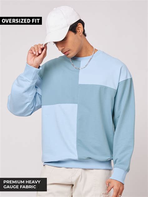 Buy Solids: Pastel Blue Colour Block Men Oversized Sweatshirts Online.