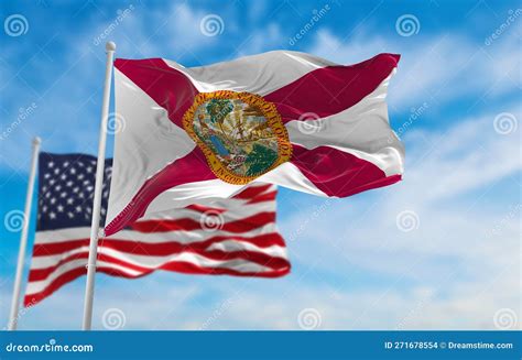 Flag of Florida State, Usa in Front of Official Flag of US at Cloudy ...