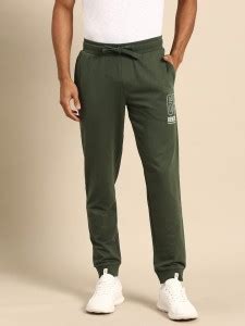 United Colors of Benetton Solid Men Dark Green Track Pants - Buy United ...