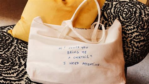 Thomas Lélu holding signature note handwritten on W Hotels paper