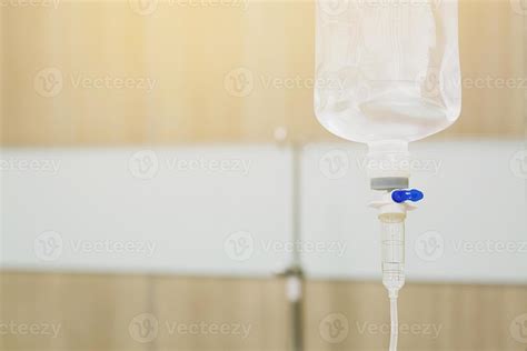 Iv saline bag infusion set and bottle on a pole. fluid intravenous drop ...