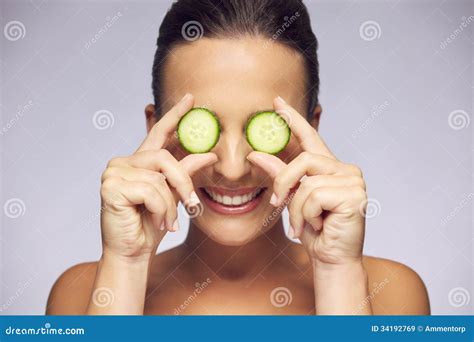 Woman Holding Slices of Cucumber Over Eyes Stock Image - Image of ...