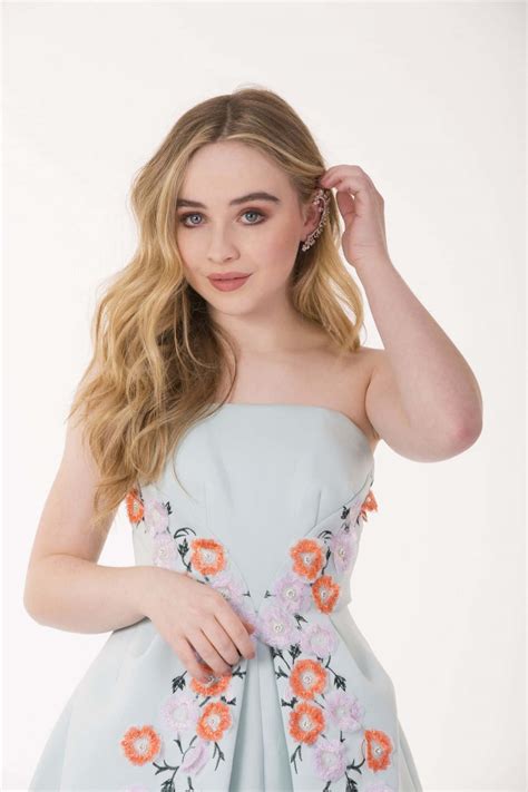 Download Sabrina Carpenter Floral Dress Portrait Wallpaper | Wallpapers.com