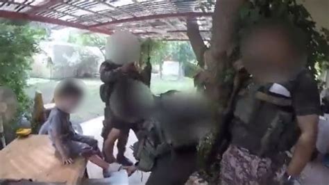 Video: Rifles in hand, Hamas terrorists cradle, give water to Israeli ...