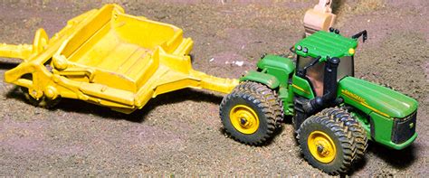 Image result for Scraper Pan Tractor