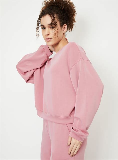 Buy Women Boxy Fit Solid Sweatshirt Online at just Rs. 999.0 ...