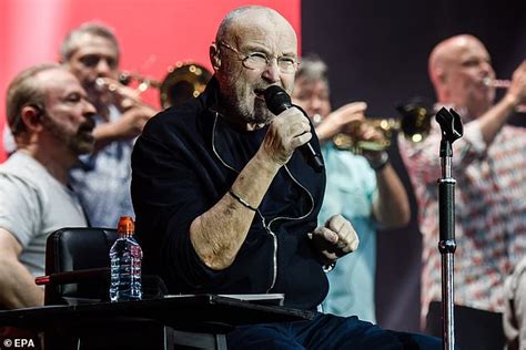 Phil Collins, 68, performs from his chair during concert in Berlin ...