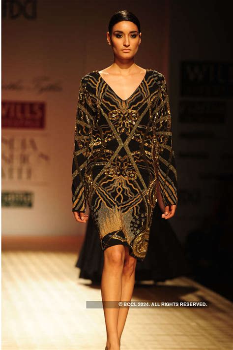 A model showcases a creation by Siddartha Tytler on Day 4 of Wills ...
