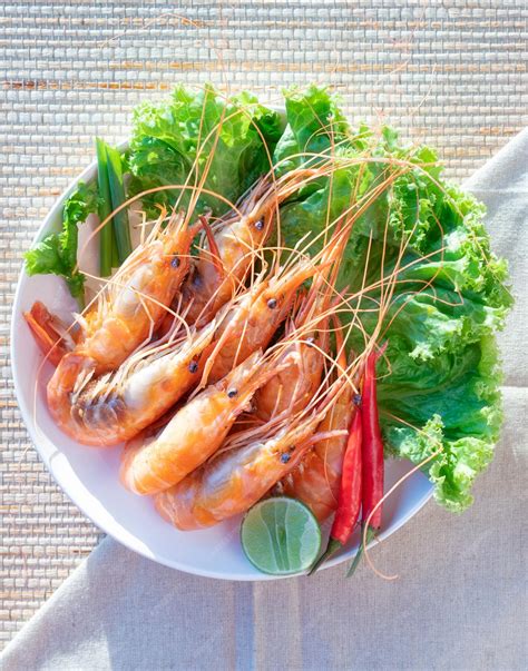 Premium Photo | Seafood food in white bowl shrimp squid shellfish
