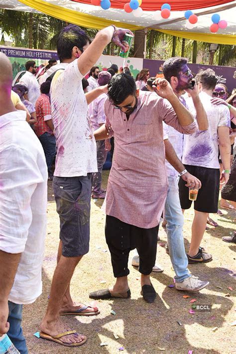 Revellers during the Box Cricket League’s Holi Invasion party, held at ...