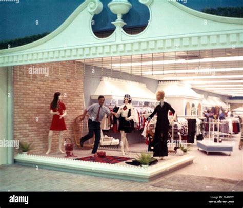 A historical image showing a man posing with mannequins at the Colony ...