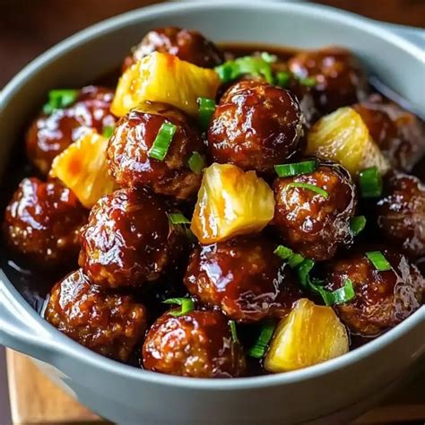 https://recipes.evsroad.com/wp-content/uploads/2024/11/Slow-Cooker-Pineapple-Barbecue-Meatballs.webp