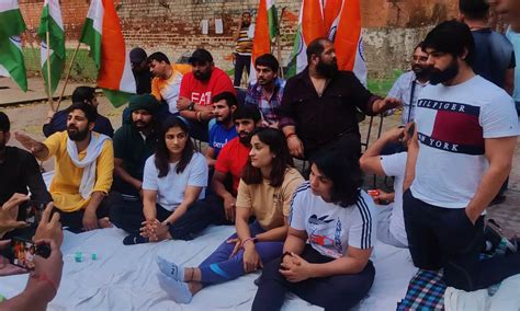 Wrestlers return to protest site; demand release of panel report on ...