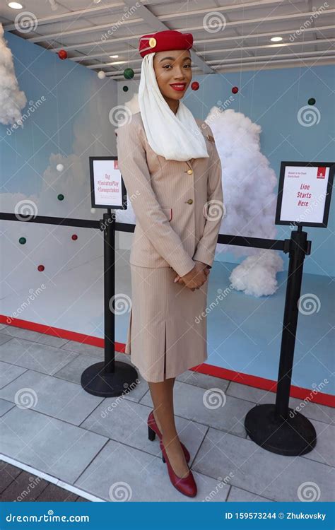 Emirates Airlines Flight Attendant at the Emirates Airlines Booth during 2019 US Open at the ...