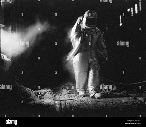 Test engineer wearing an exposure suit that allows metallurgists to work under the temperature ...