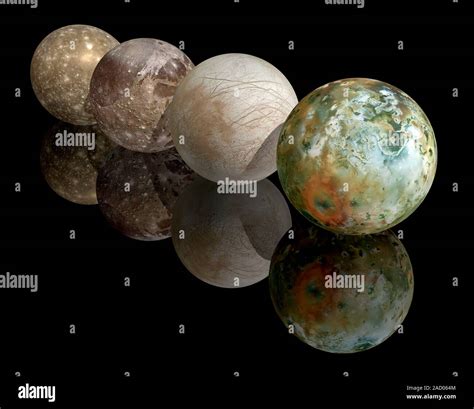 Moons of Jupiter. Computer illustration showing the four largest moons of the planet Jupiter ...